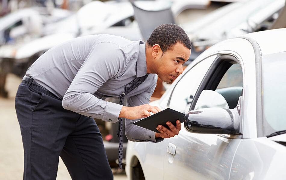 mechanic inspecting car